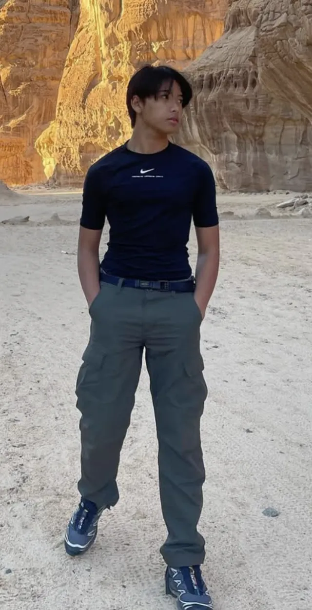 Kiki, owner of Dragon Dance Collectibles, standing in a desert canyon